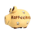 Beiges Keramik Sparschwein, braune Details (Schweineohren und Füße) weiße Nopppen an der Unterseite der füße, braune Aufschrift "Kaffeekasse", Kafeetassen Motiv, schwarz gemalte Gesichtszüge