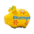 Keramik Sparschwein, intensives Gelb, grüne Details (Füße und Schweinohren), Blaue Aufschrift: Elterngel, orangene Blumen, gesichtszüge in schwarz, 9 x 9 x 12,5 cm großes Sparschwein, glänzende Oberfläche