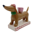 Kerzenhalter kleiner Dackel mit roter Mütze für Stabkerzen