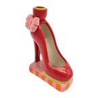 Kerzenhalter in Form eines roten High Heels mit pinker Schleife und gestreifem Unterboden