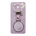 Ring mit Schlüsselanhänger mit einem kleinen Engel und einem runden Symbol in dem steht "Ein Engel für dich!" mit pinkem Hintergrund in der Verpackung