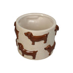 Beige Blumentopf mit haptischen Formen von Dackeln