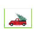 Weiße Fahrkarte mit einem Aufdruck eines roten Trucks mit einer Tanne hinten auf der Aufladefläche und unten mit der Schrift "Christmas is coming"