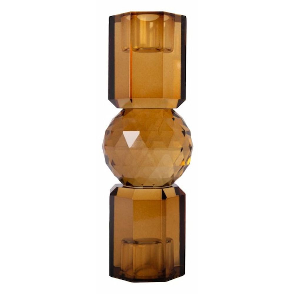Ein hoher wendbarer Kerzenhalter aus Glas in Goldbraun Kristall-Optik, bestehend aus mehreren geometrischen Flächen. Der Kerzenhalter hat eine moderne, facettierte Optik, die das Licht reflektiert