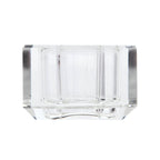 Ein kleiner Dioptrics Kerzenhalter aus Glas in Klarer Kristall-Optik, bestehend aus mehreren geometrischen Flächen. Der Kerzenhalter hat eine moderne, facettierte Optik, die das Licht reflektiert