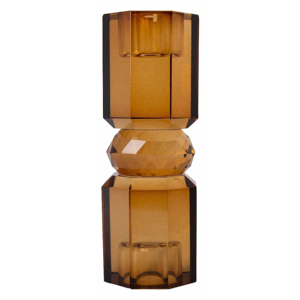 Ein hoher wendbarer Kerzenhalter aus Glas in Brauner Kristall-Optik, bestehend aus mehreren geometrischen Flächen.