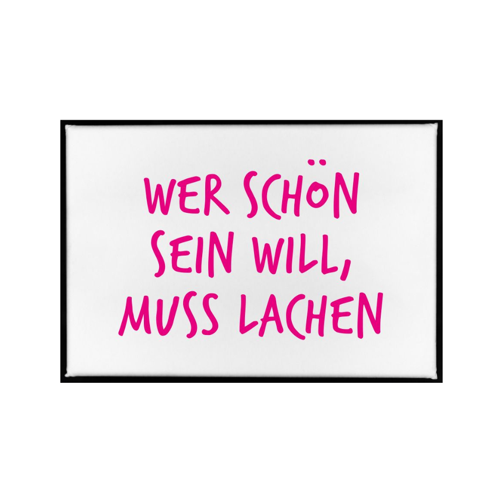Ein Magnet mit Pinken Spruch ''wer schön sein will muss lachen''