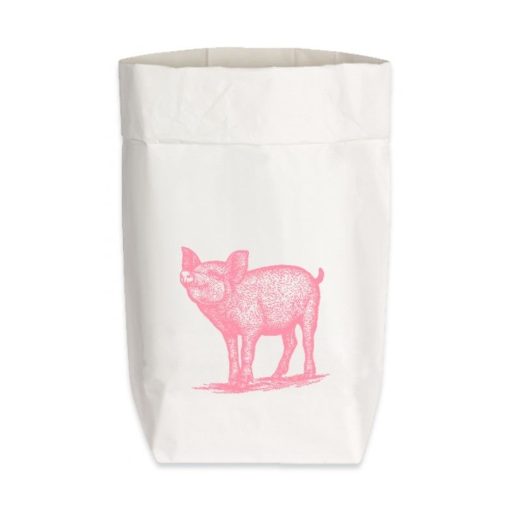 Eine weiße Papiertüte aus starkem Papier mit einem pinken, aufgedruckten Schweinchen