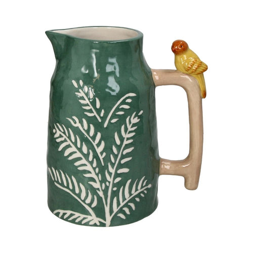 Gruene Vase in Form einer alten Teekanne mit Henkel und Vogel