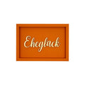 Rechteckige orangene Wanddekoration mit der Schrift "Eheglück"