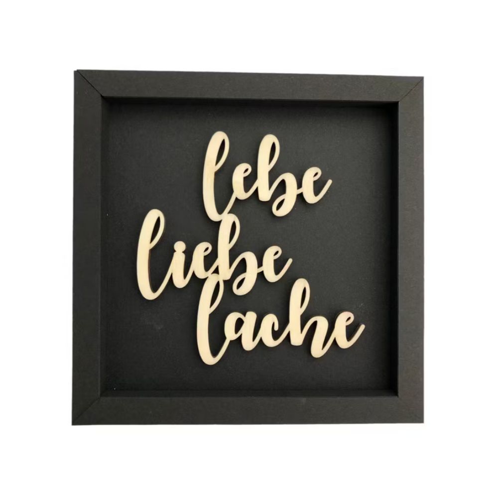 Schwarze Quadratische Wanddekoration Wandspruch mit der Schrift "Lebe Liebe Lache"