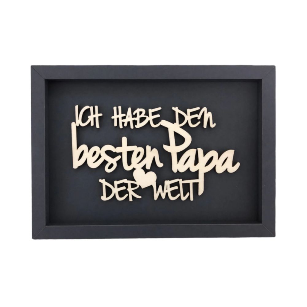 Schwarze Wanddekoration mit dem Spruch "Ich habe den besten Papa der Welt" in Weißer Schreibschrift