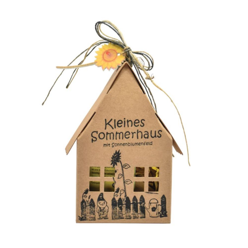 Braune Papierbox in Form eines Hauses mit der Schrift "Kleines Sommerhaus mit Sonnenblumenfeld". Zusätzlich sind Gartenutensilien und ein Gartenzwerg aufgedruckt