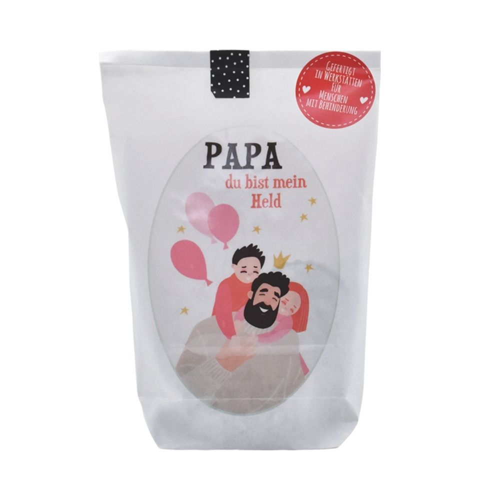 Weiße Wundertüte mit einem Abgebildeten Vater den zwei Kinder umklammern und der Schrift "Papa du bist mein Held"