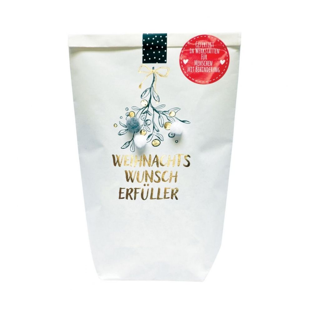 Weiße Wundertüte mit grünem goldenen Zweig Aufdruck und einer goldenen Schrift "WEIHNACHTS WUNSCH ERFÜLLER" und einem Sticker "Gefertigt in Werkstätten für Menschen mit Behinderung"