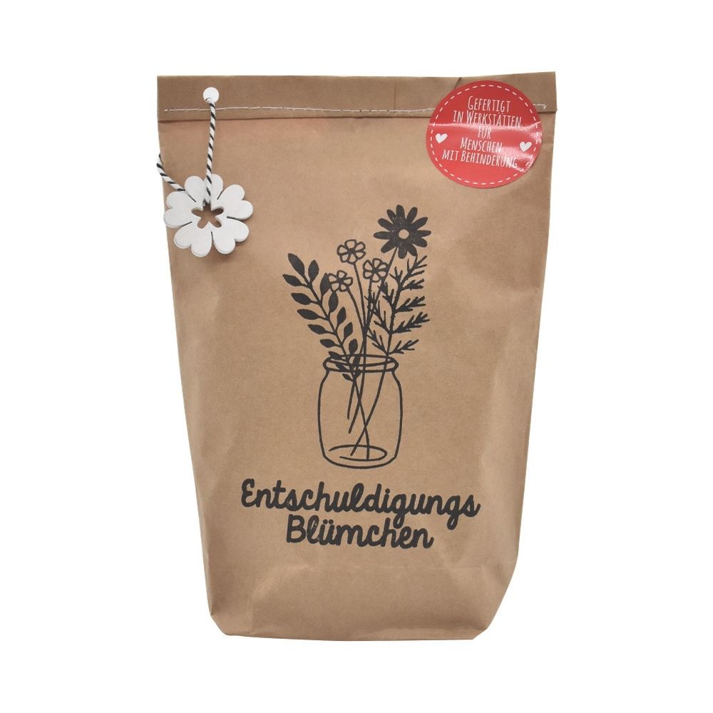 Braune Wundertüte mit Schwarzem Audruck eines Glases mit enthaltenen Pflanzen und der Schrift darunter "Entschuldigungs Blümchen" und einem an der Tüte angehangenen weißen Filz Blümchen