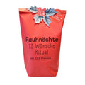 Rote Wundertüte mit einer Oben angebrachten Mistelzweig Illustration und der Schwarzen Schrift "Rauhnächte 12 Wünsche Ritual mit ILEX Pflanzset"