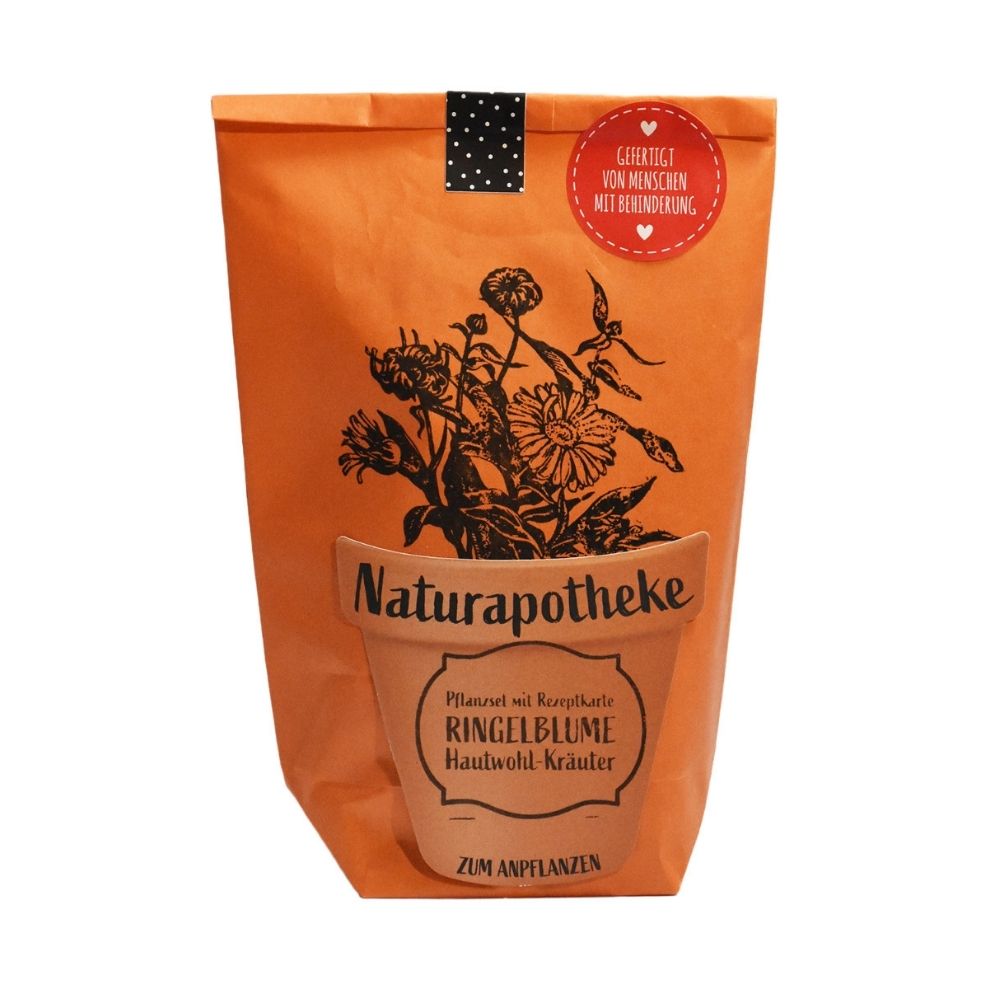Orangene Wundertüte mit einem aufgeklebten Topf auf dem "Naturaphotheke Pflanzset Ringelblume" steht und aufgedruckter Blume die aus dem Topf wächst
