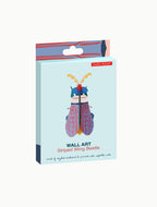 Die 3D Wanddekoration Wandobjekt "Striped Wing Beetle" in der Verpackung