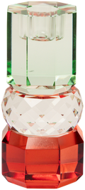 Ein hoher Kerzenhalter aus Glas in Rot, Klar und Hellminze Kristall-Optik, bestehend aus mehreren geometrischen Flächen. Der Kerzenhalter hat eine moderne, facettierte Optik, die das Licht reflektiert