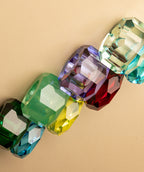 Vier Kristall-Kerzenhalter in vielen Farben