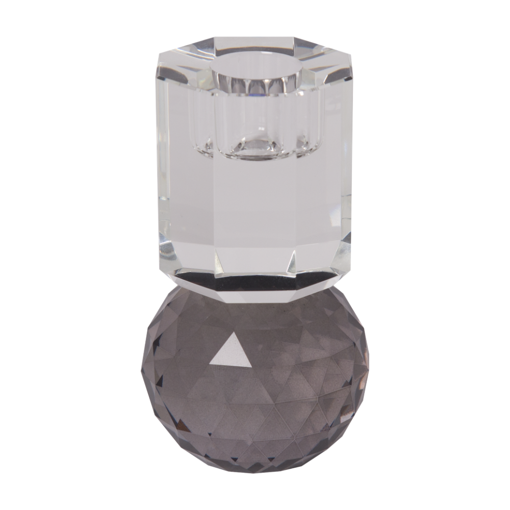 Ein hoher Kerzenhalter aus Glas in Grau und Klarer Kristall-Optik, bestehend aus mehreren geometrischen Flächen. Der Kerzenhalter hat eine moderne, facettierte Optik, die das Licht reflektiert