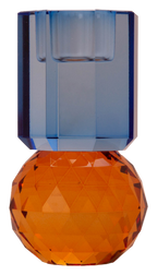 Schwach belichteter, hoher wendbarer Dioptrics Kerzenhalter aus Glas in Bernstein und Kobalt Kristall-Optik, bestehend aus mehreren geometrischen Flächen. Der Kerzenhalter hat eine moderne, facettierte Optik, die das Licht reflektiert