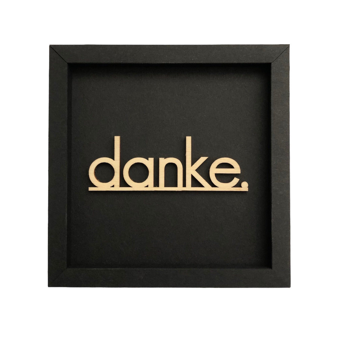 Quadratische dunkelgraue Wanddekoration mit der Schrift "Danke."