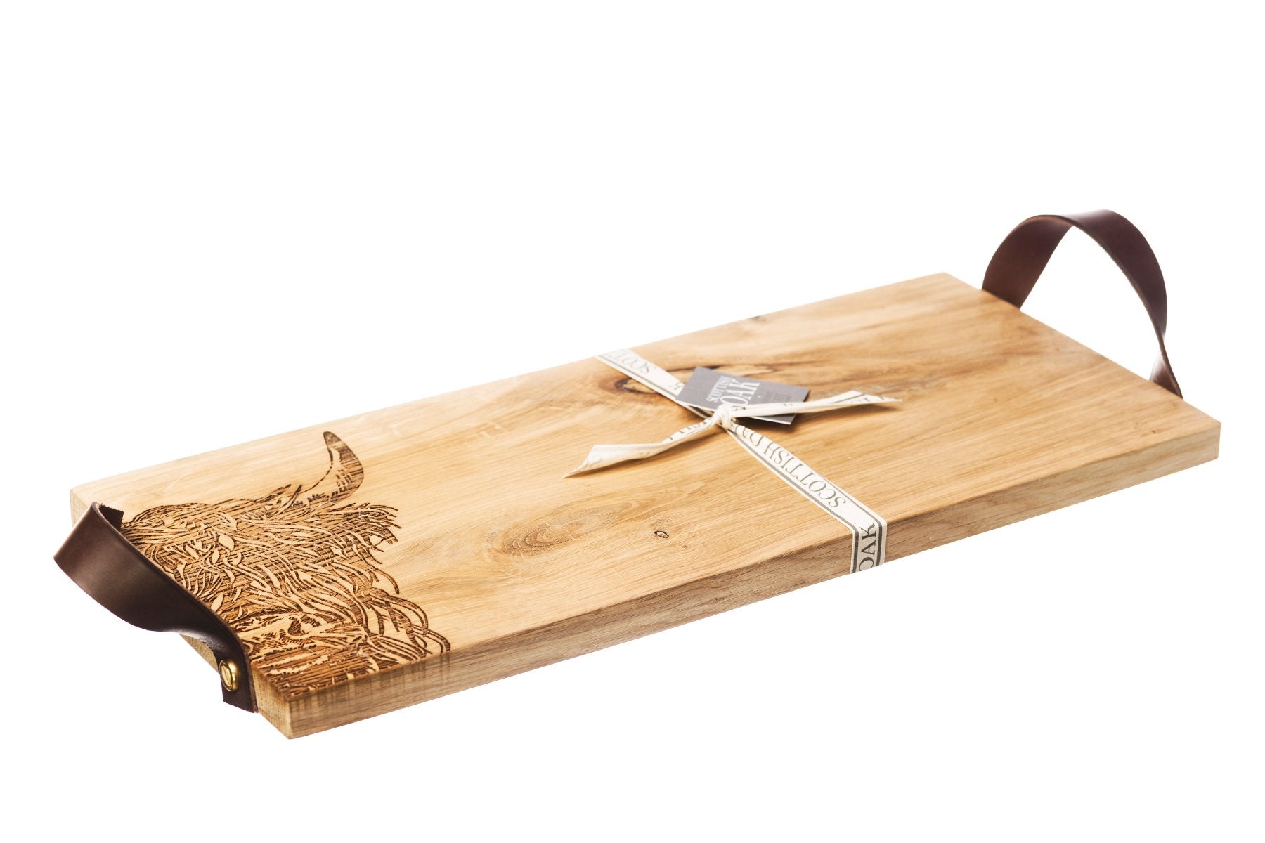 Serviertablett aus schottischer Eiche mit einem eingebrannten Hochlandrind-Motiv und zwei Lederriemen links und rechts