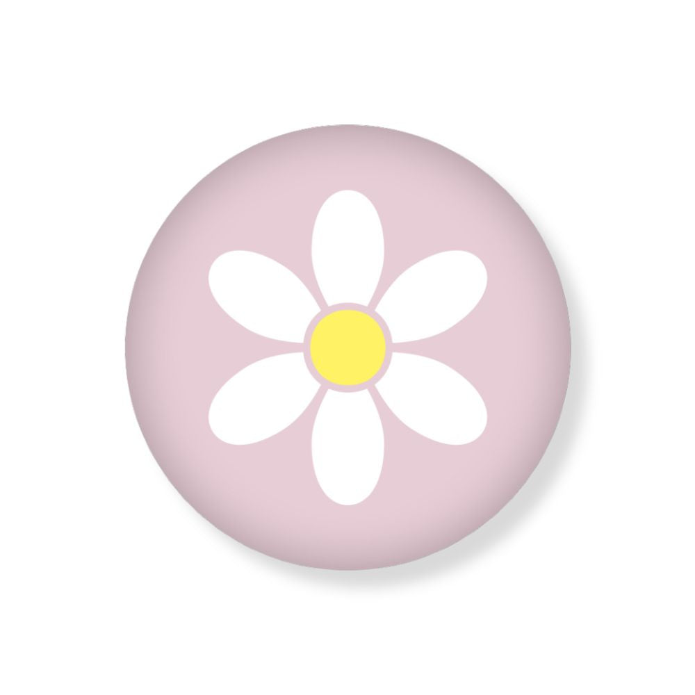 Runder Magnet mit einem pinken Hintergrund und mit einem weißen Motiv