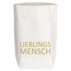 Tüte aus Kraftpapier mit einer aufgedruckten goldenen Schrift "Lieblings Mensch"
